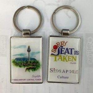 Discover unique Singapore-themed keychains featuring iconic landmarks and playful cultural references.